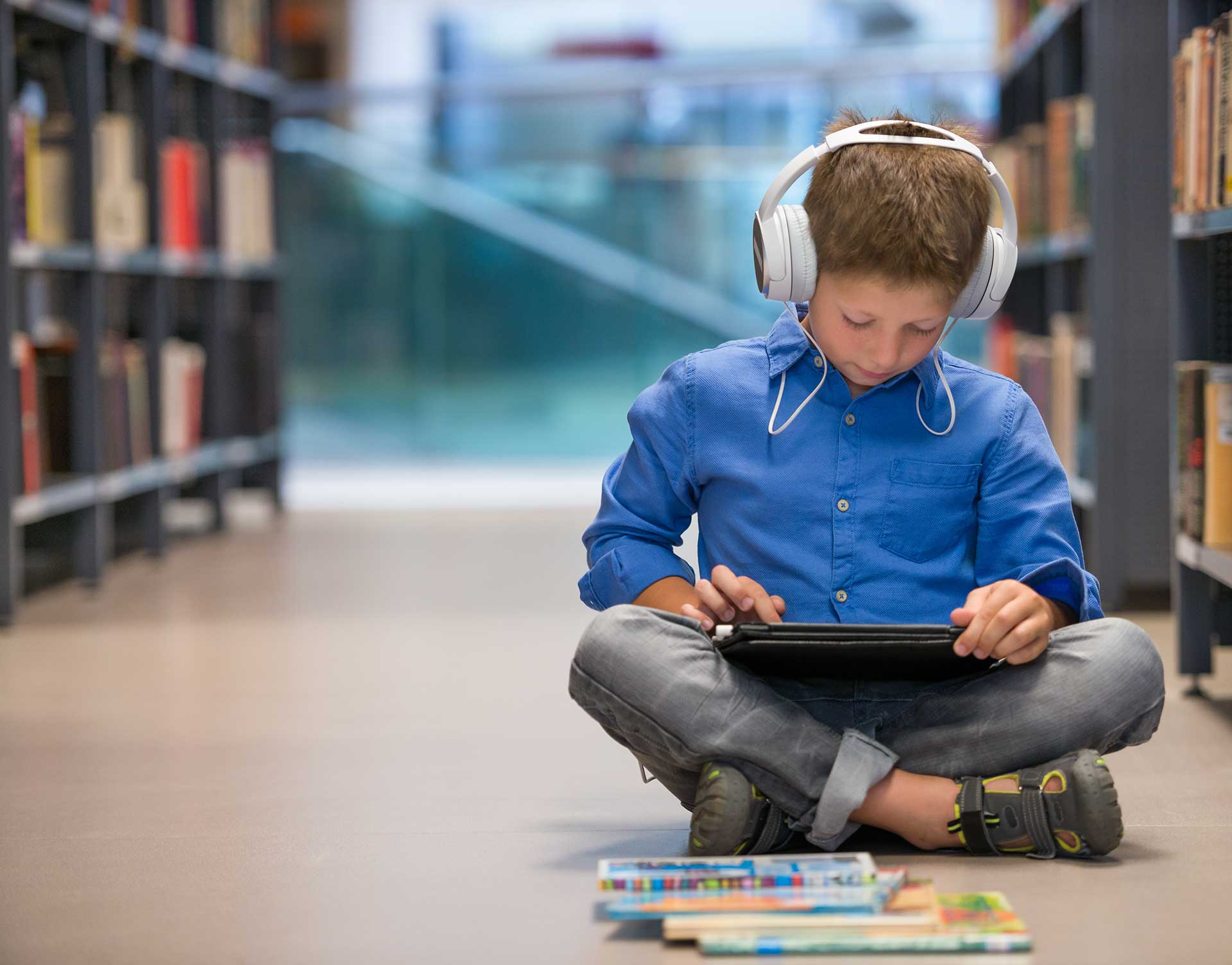 Student using tablet to read audiobooks